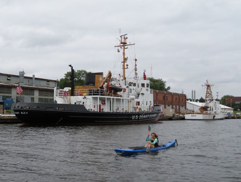 Norma kayaking with the Katmai Bay behind