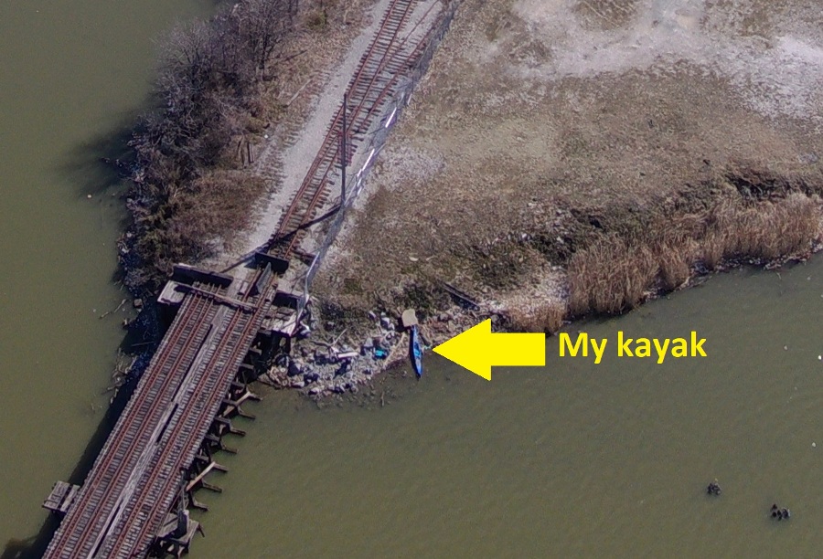 Zoomed in shot showing my kayak and the train bridge