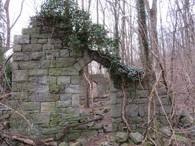 View through two openings at the ruins where there were once windows