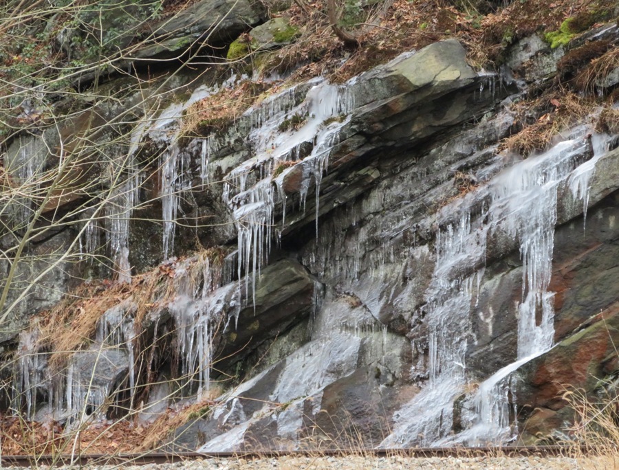 Ice on vertical rocks across the river