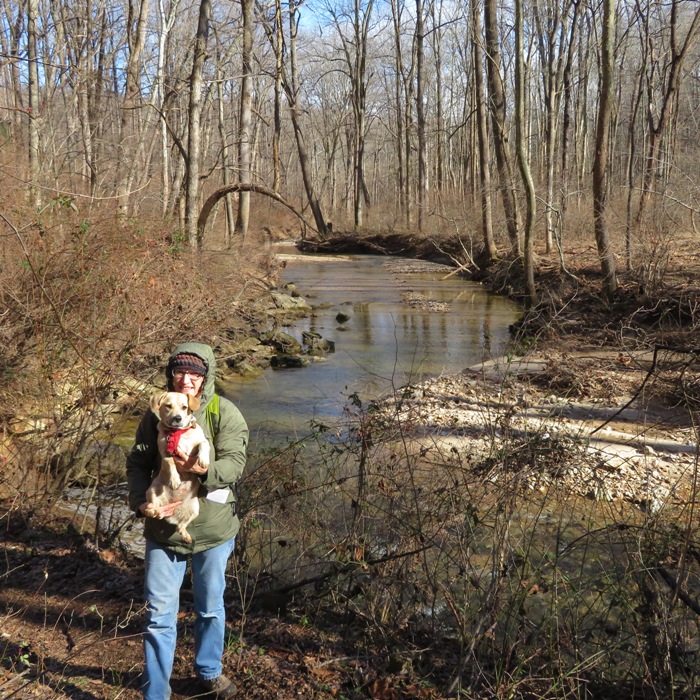 Norma holding Daphne with the river behind