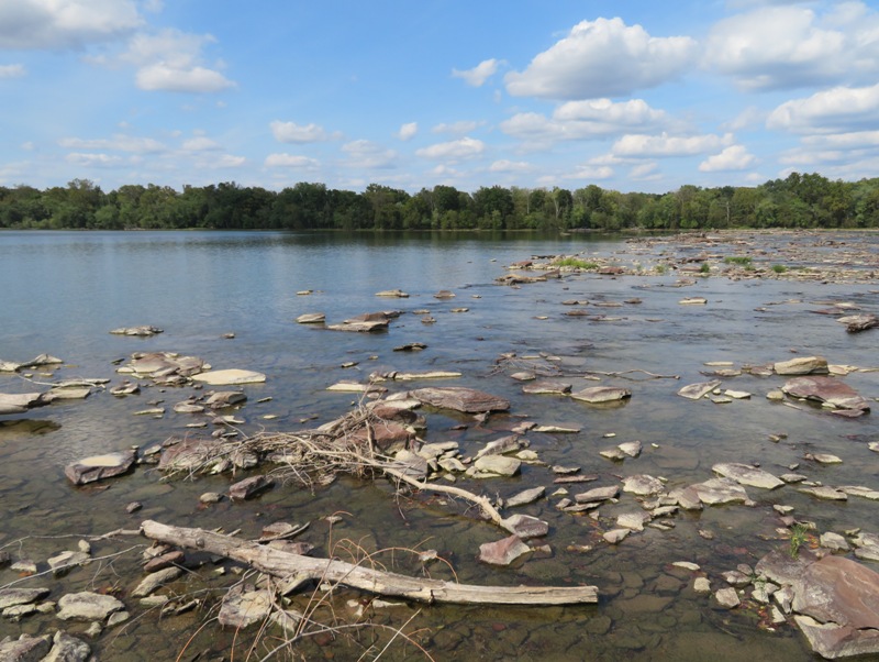Upstream view showing where rubble from Dam 2 starts