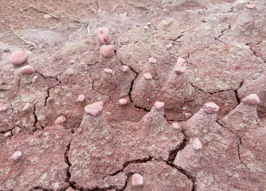 Ground wearing away from small rocks