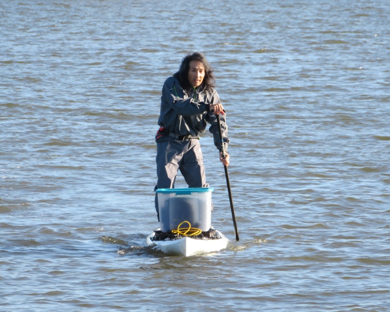 Me on SUP with big box containing my drone