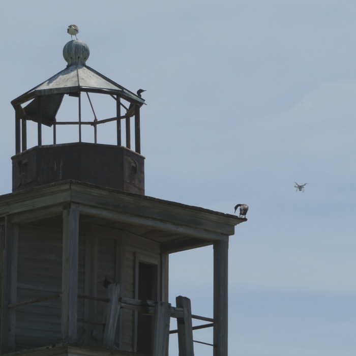 Lighthouse with drone in background