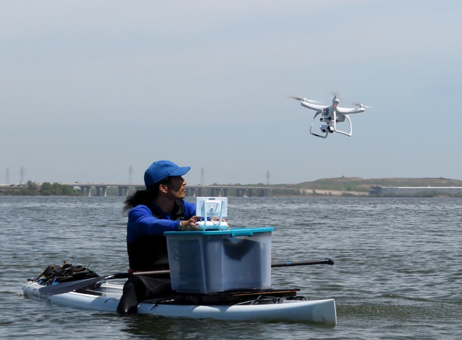 Me on SUP with drone next to me in flight