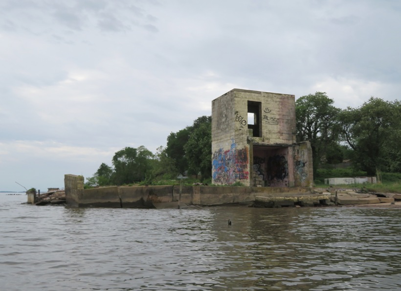 Two story cinder block ruins on beach