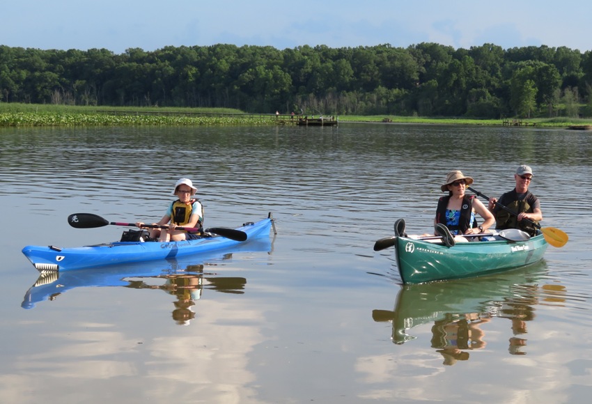 Norma, Sara, and Mike on the water in their boats