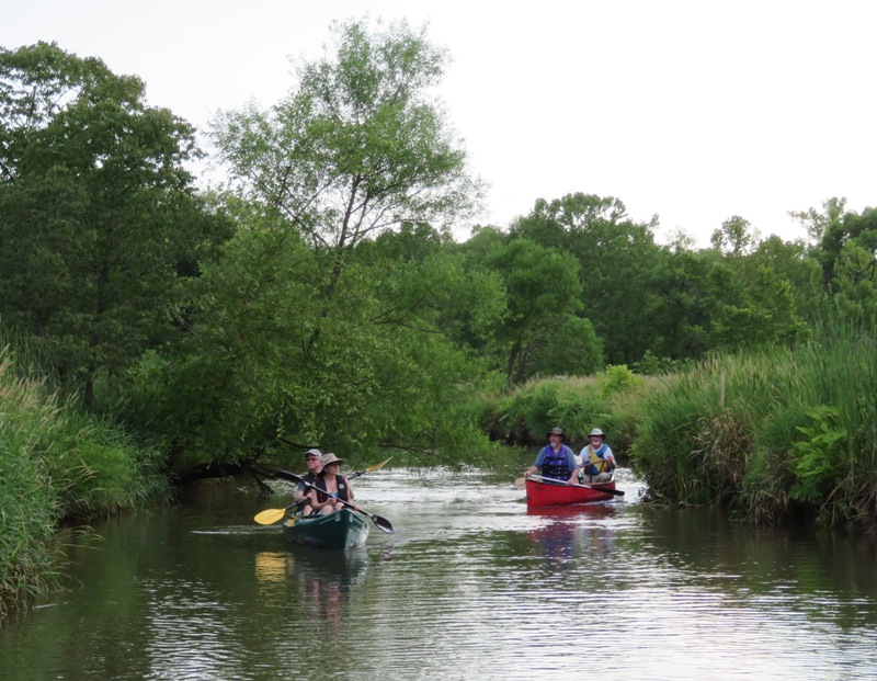 Sara, Mike, and two other paddlers in a canoe