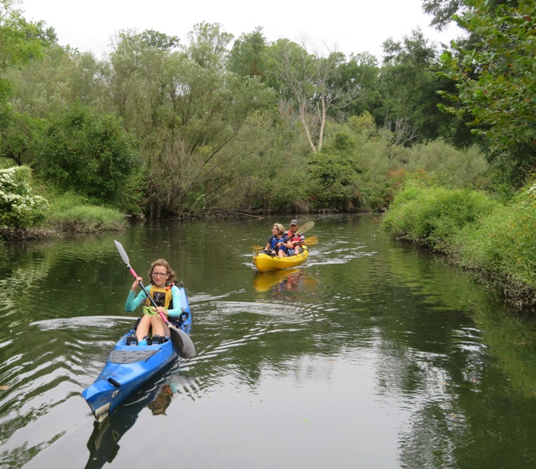Norma, Beate, and Gerhard kayaking with Norma in the lead