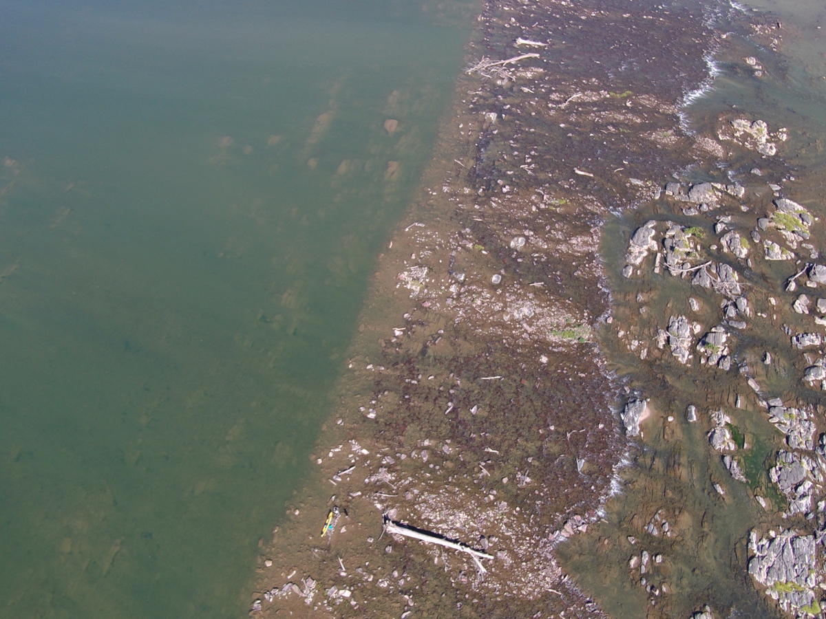 Higher altitude view of sudden change between open water and rubble on the Potomac River