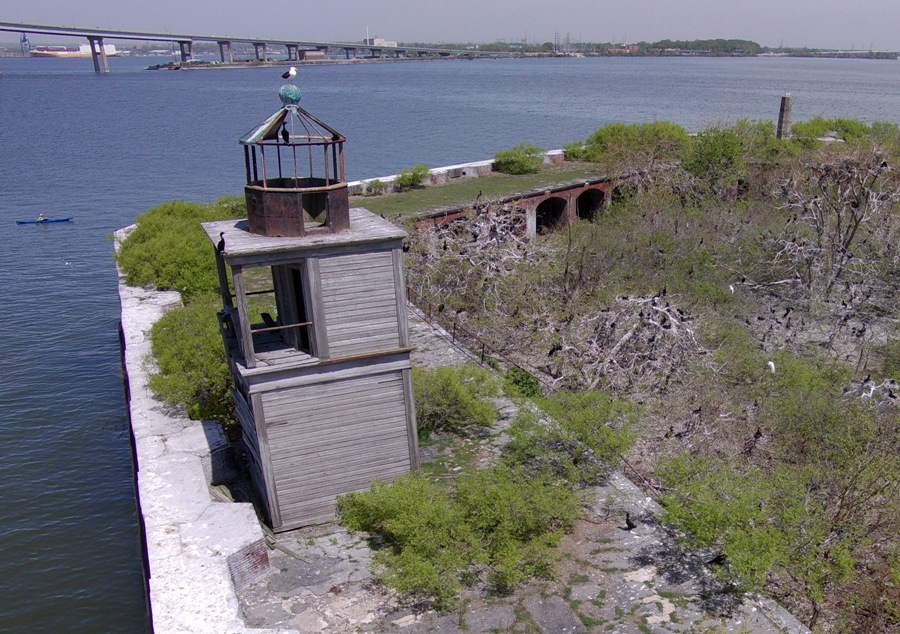 Drone view of lighthouse with Norma in kayak and Key Bridge in background