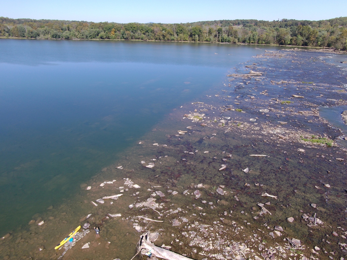 Sudden change between open water and rubble on the Potomac River with me waving