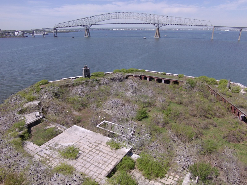 Partial view of fort, lighthouse, and Key Bridge behind