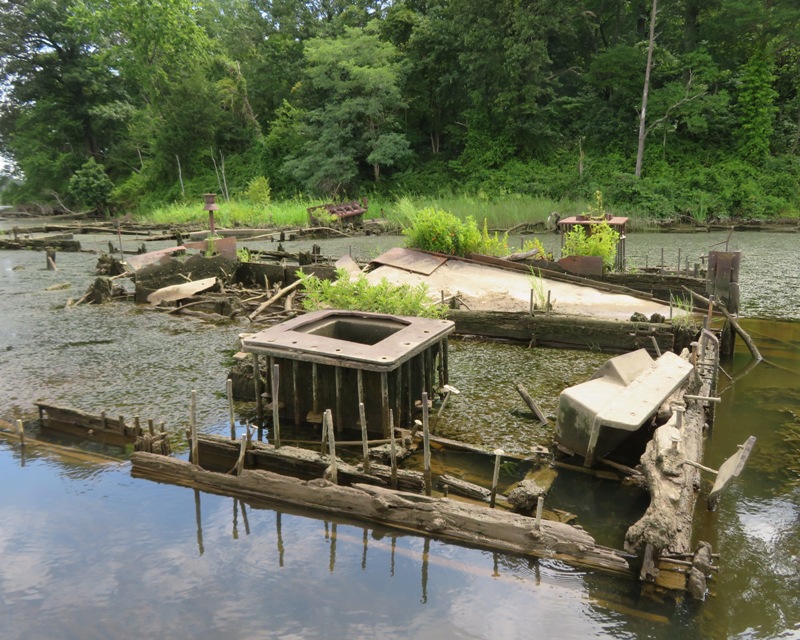 Box-shaped barge with lots of metal stuff inside