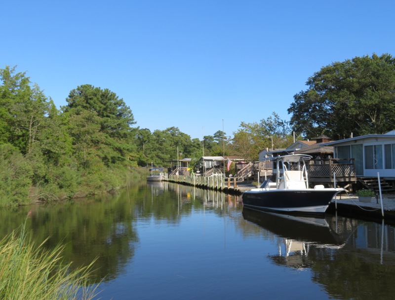 Natural area right by the homes across the narrow waterway