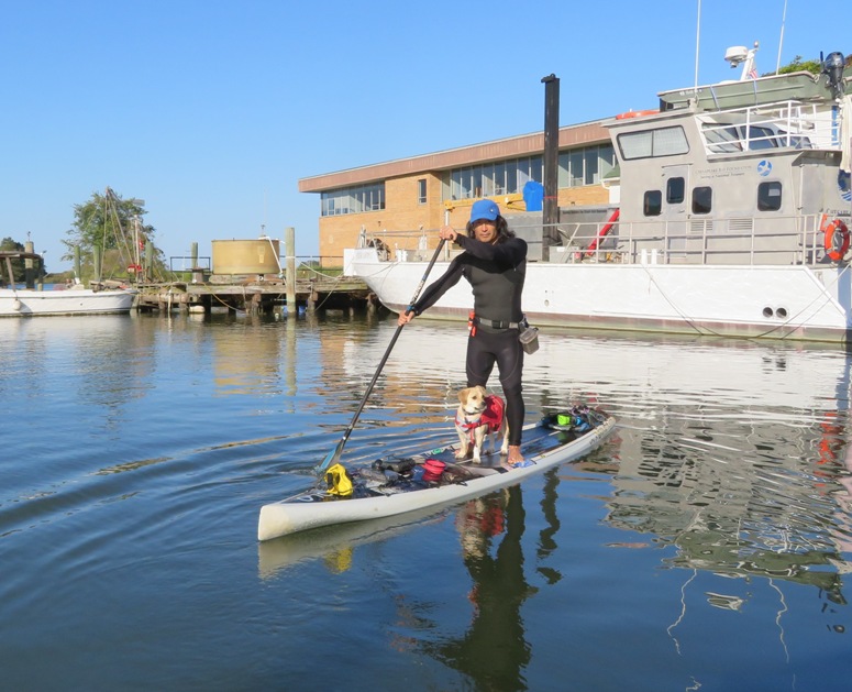 Daphne and I on SUP in front of the Patricia Campbell power boat