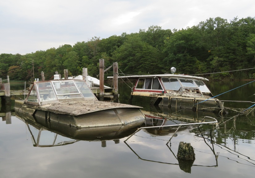 Two boats mostly underwater