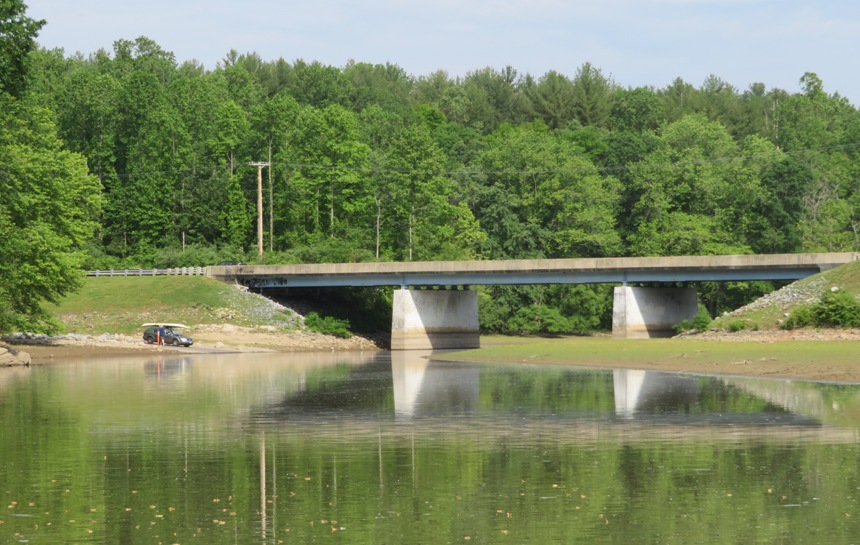 Boat ramp, vehicle with kayak on it, and Browns Bridge