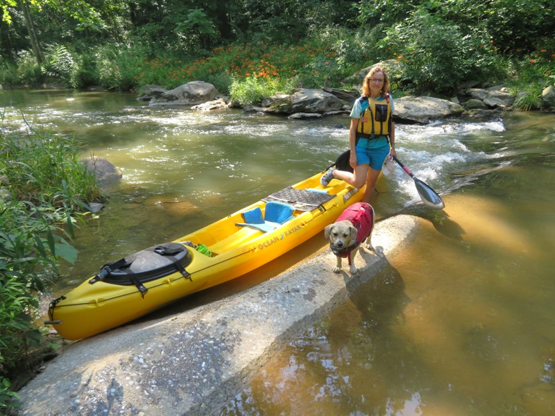 Norma and Daphne with boat, standing on dam