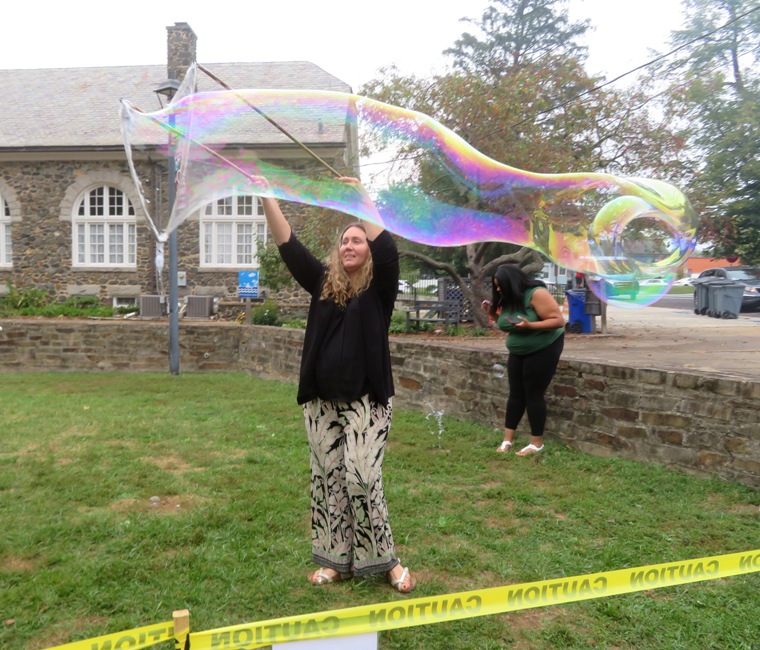 Spinning with the small wand to make a bubble