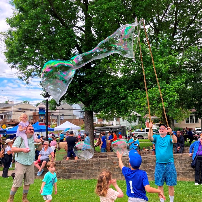 Making bubble with the medium-sized wand