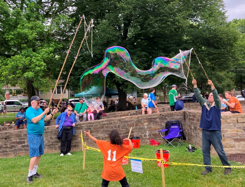 Making a long bubble with the small wand