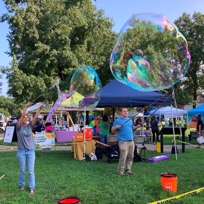 Woman and man making bubbles