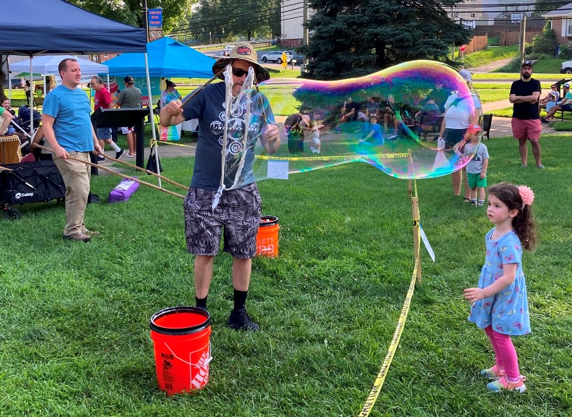 Man making bubble with the small wand