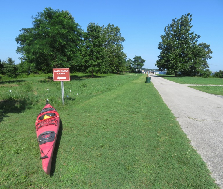 My kayak next to the 'Canoe/kayak launch' sign