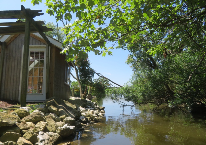 Shack next to narrow waterway