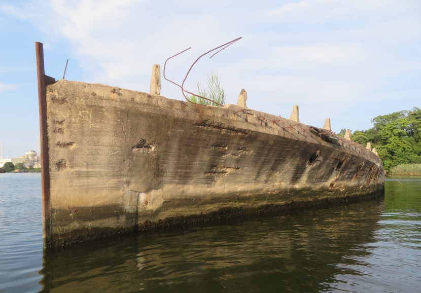 Front port view of concrete boat