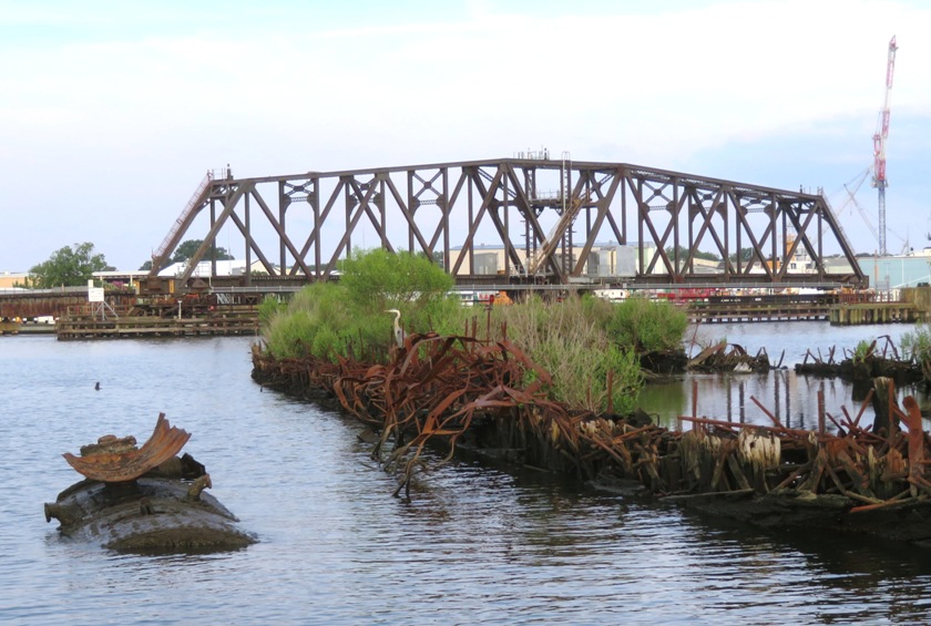 Great blue heron, shipwreck, and swinging train bridge