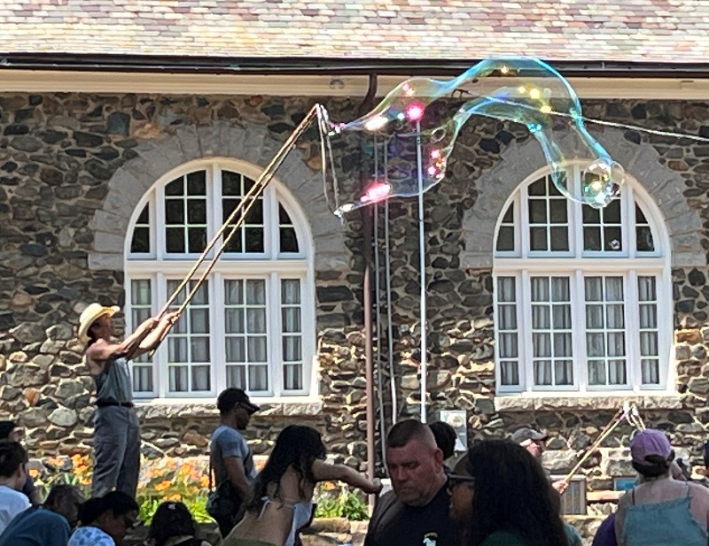 Me standing on stone wall making bubbles