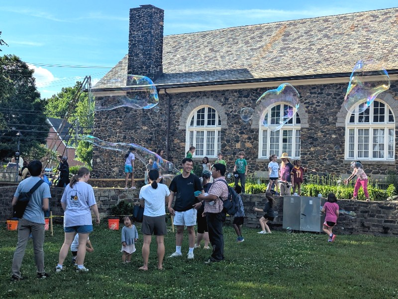 Bubbles at Savage Farmers Market with people standing in front