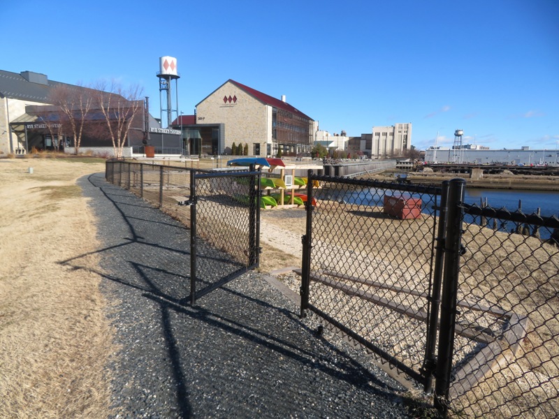 Black chain-link fence and gate leading to launch area