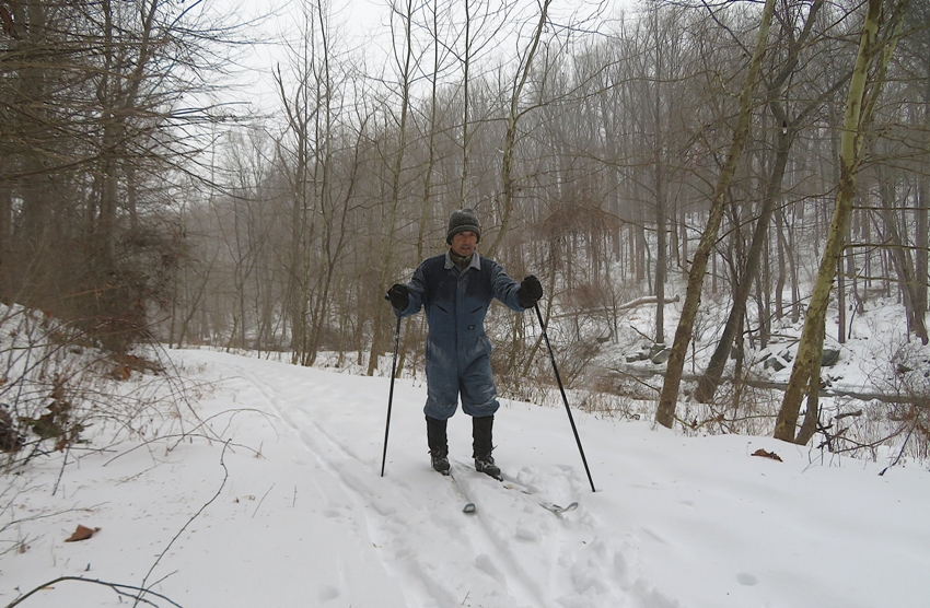 Me on skis near Highway 95 with trees in the background