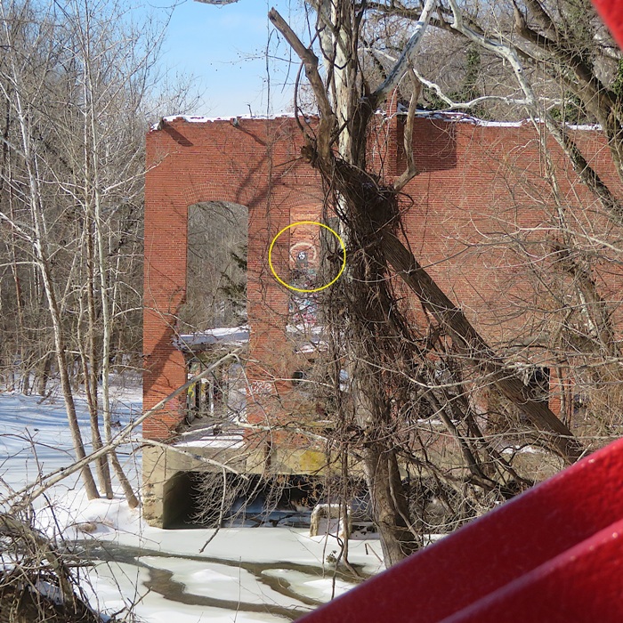 Large powerhouse ruins as seen from the Bollman Truss Bridge