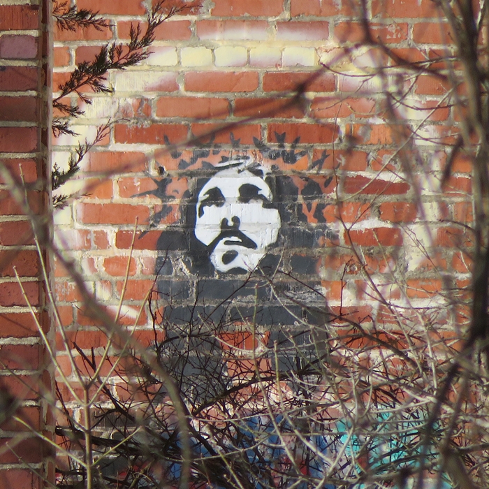 Spray-painted Jesus on an interior wall of the large powerhouse ruins
